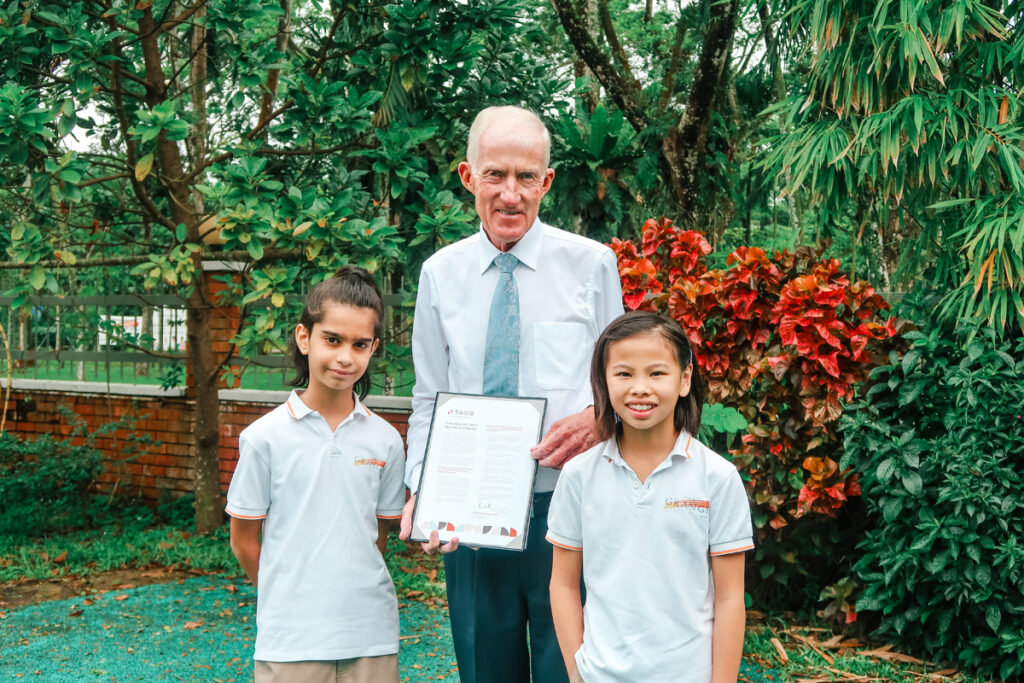 Mr. Ronald Stones with student ambassadors