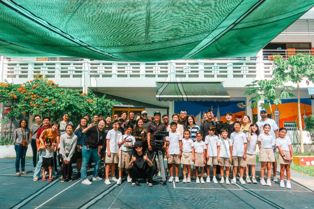 Group photo of parents, teachers and children at an international primary school