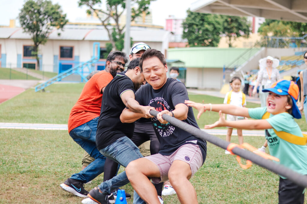 Parents playing Tug of War